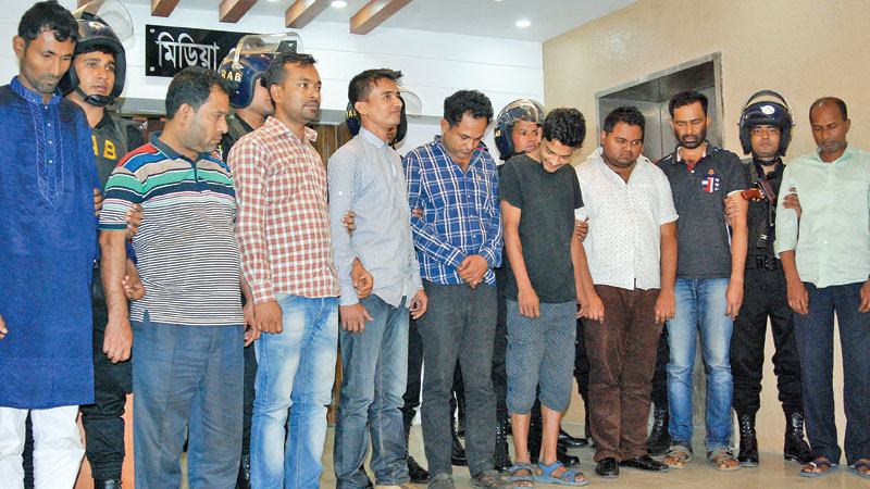 11 held over ATM card forgery   