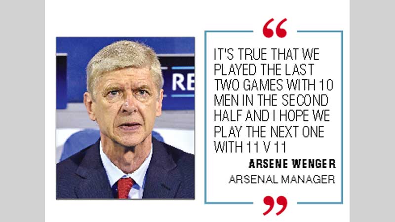 Arsene Wenger warns Arsenal to keep cool 