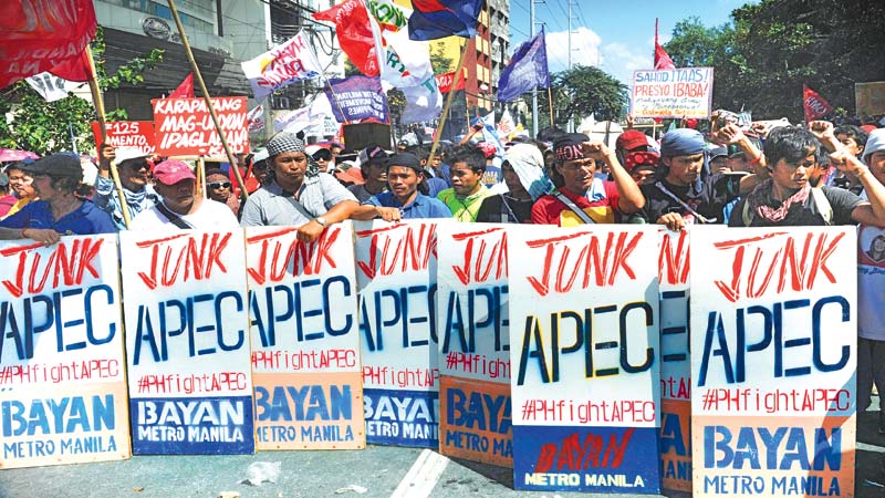 Protests, China Sea tensions at APEC summit