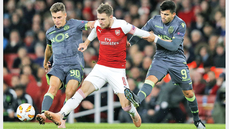 Arsenal progress despite Sporting draw