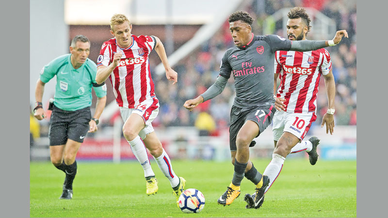 Stoke sink Arsenal as Man United hit four again
