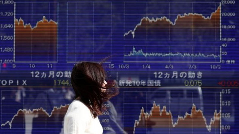 Asian markets up on Clinton hopes but traders on edge