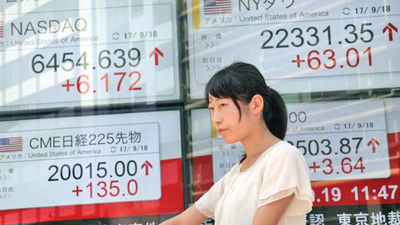 Asia markets gain after Wall Street notches up records