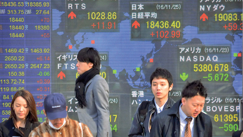 Asia stocks end week with 
rally, dollar takes breather	