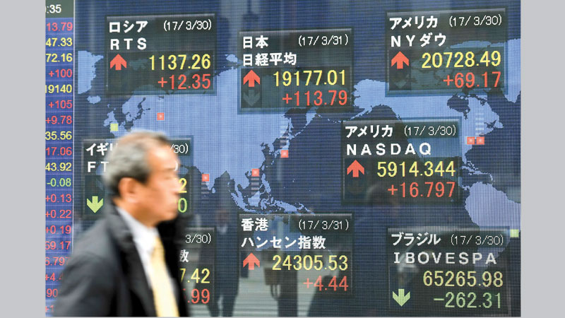 Asian markets lower as quarter draws to close