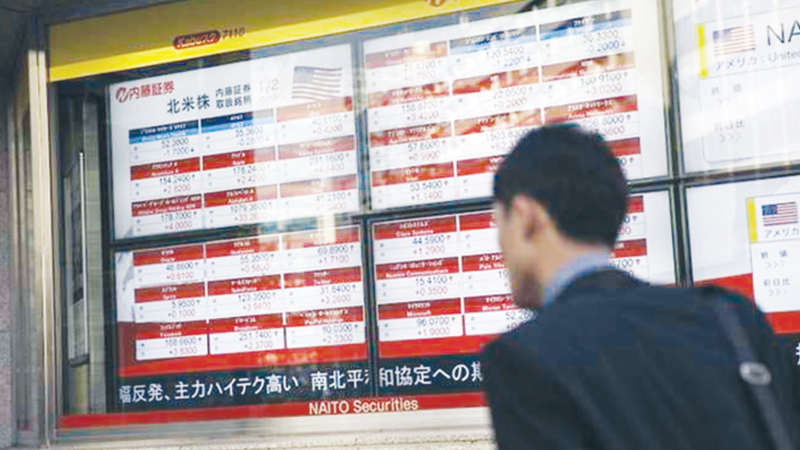 Asian markets mostly up as trade woes give way to earnings hopes