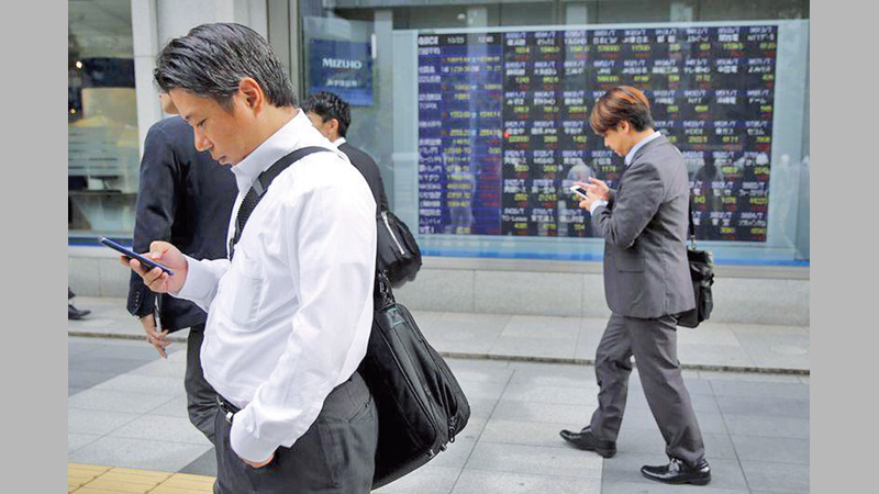 Asian markets mostly 
dip as US, Japan bank meetings eyed
