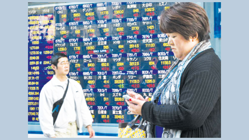 Asian markets mixed but tech firms sink