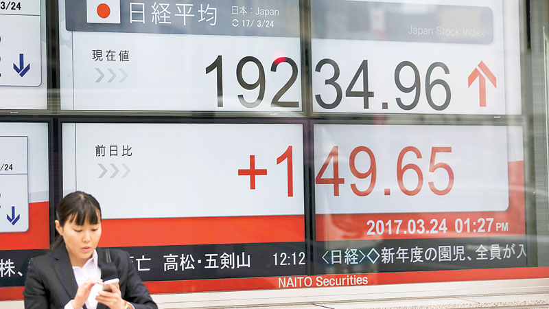 Asian traders on edge ahead of key US healthcare vote
