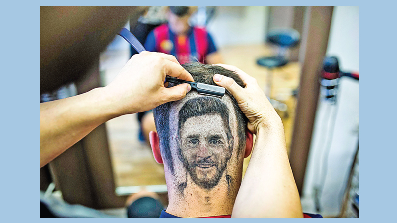 Barber of Serbia snips Messi 
‘headshot’ for World Cup fans