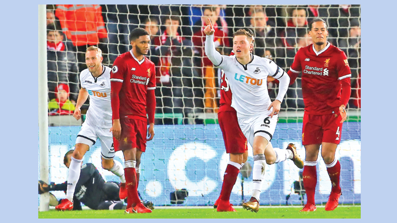 Battling Swansea shock Liverpool