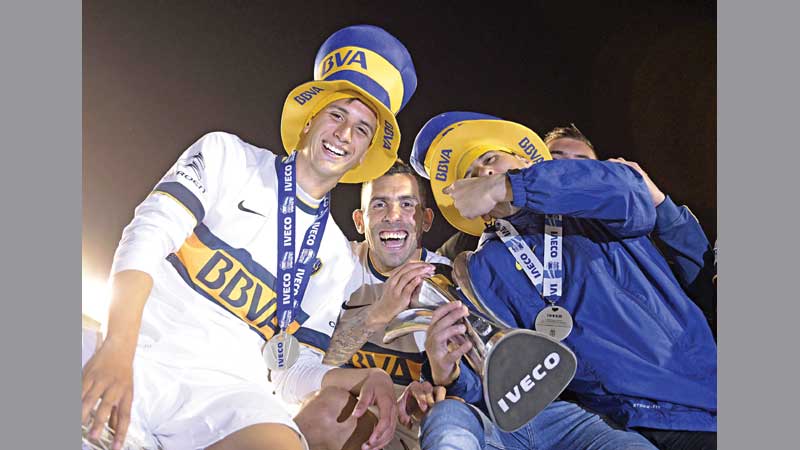 Tevez inspires Boca to win 1st title since 2011 