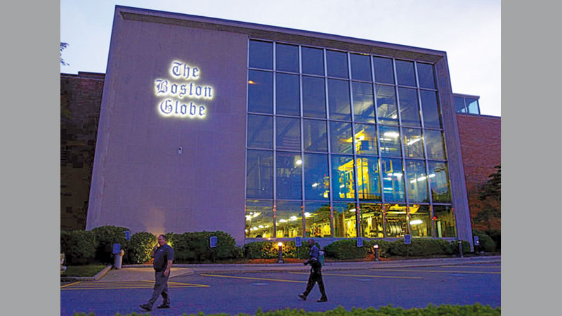 Boston Globe reporters hand deliver newspapers 