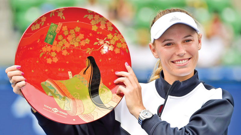 Wozniacki whips Russian to retain Tokyo crown