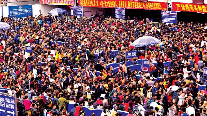 Tens of thousands of Chinese new year travellers stranded