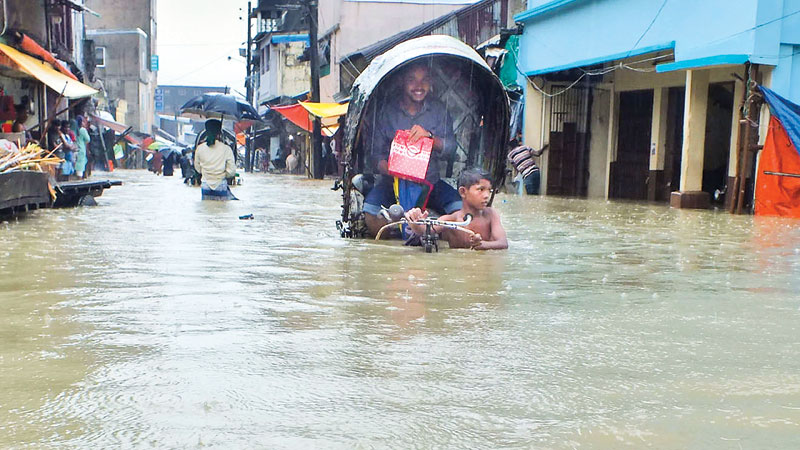 Heavy rain, tidal water cripple life in Ctg