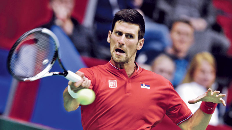 Djokovic puts Serbia on course for semifinals