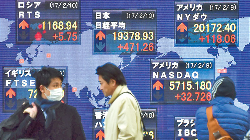 Dollar, Asia markets boosted as Trump pledges tax move