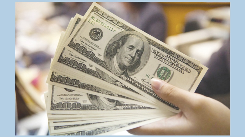 Dollar picks up ahead of Fed but stocks mostly retreat