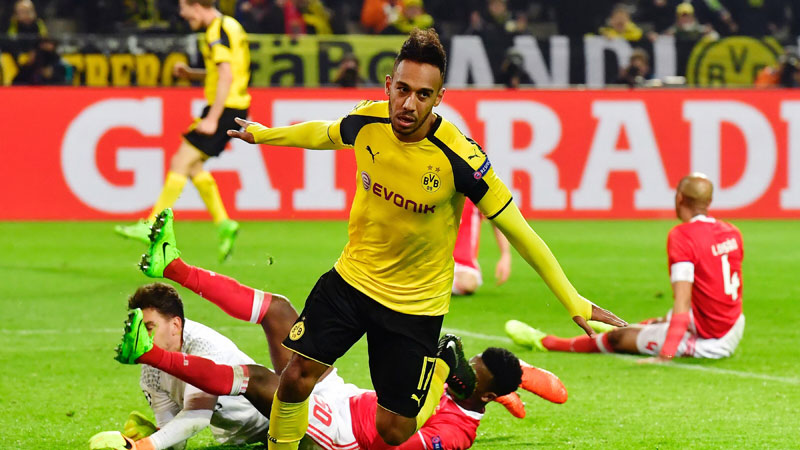 Aubameyang treble fires Dortmund into quarters