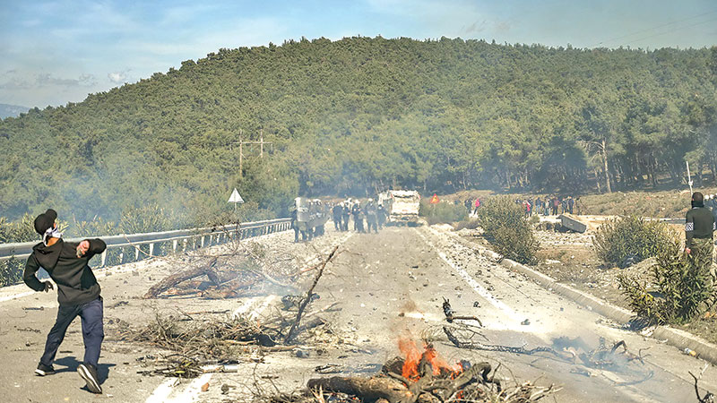 Dozens hurt as island clashes intensify