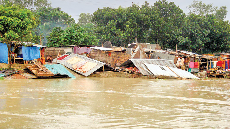 Erosion-hit people take shelter on vulnerable embankments 