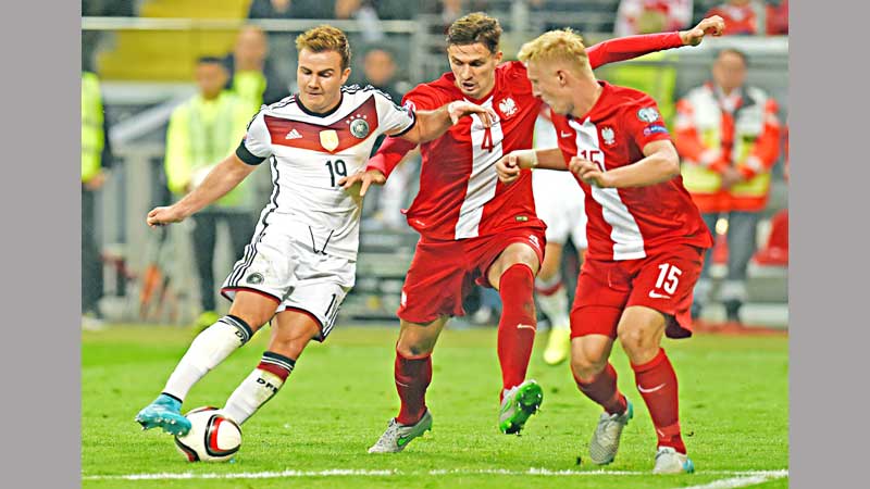 Germany power past Poland to go top