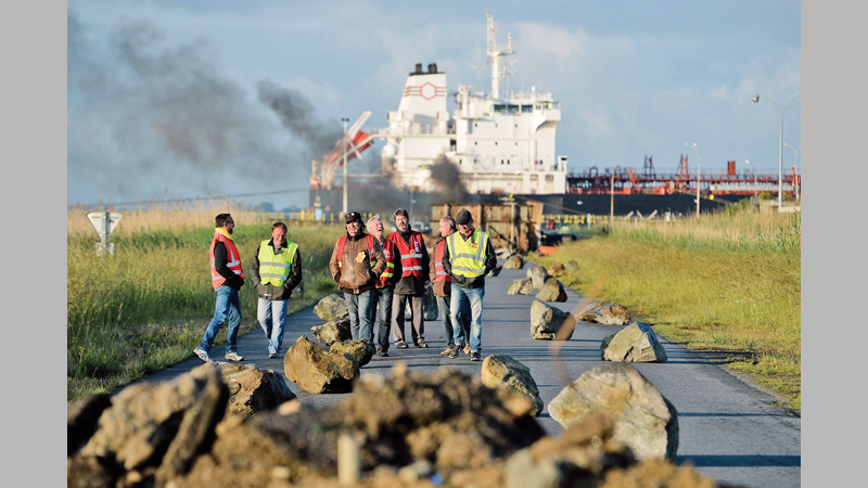 Strike-hit France dips into fuel reserves
