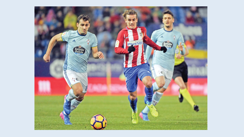 Griezmann seals Atletico fightback