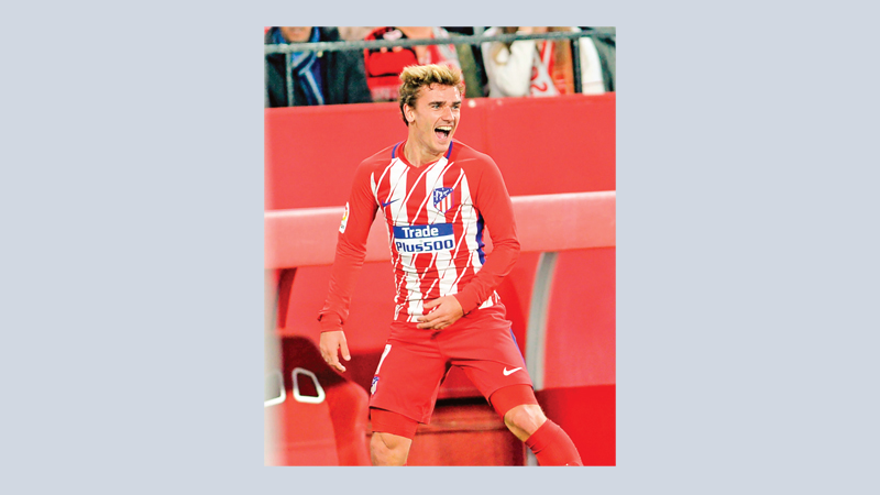 Griezmann slams hat-trick 
as Atletico rout Sevilla