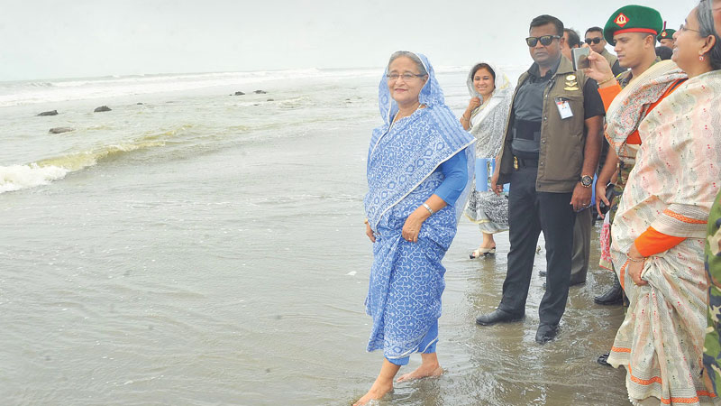 Hasina takes a walk on Inani beach
