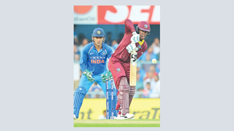 Hetmyer century powers West Indies to 322-8