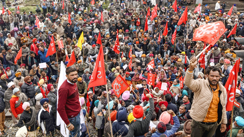Indian police open fire to clear strike protests