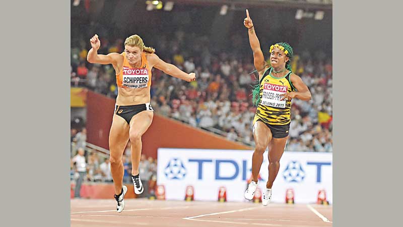 Fraser-Pryce bags world 100m treble
