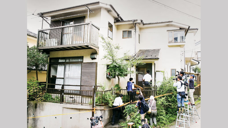 Japan knife attacker grins before cameras
