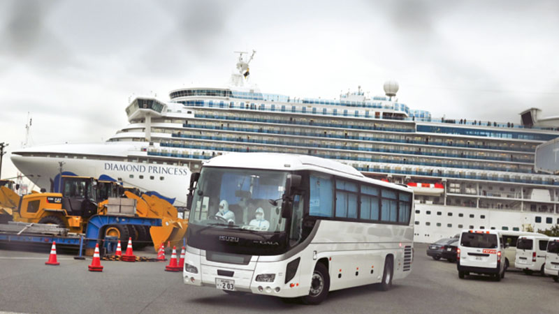 Japan lets some passengers leave ship for quarantine on land