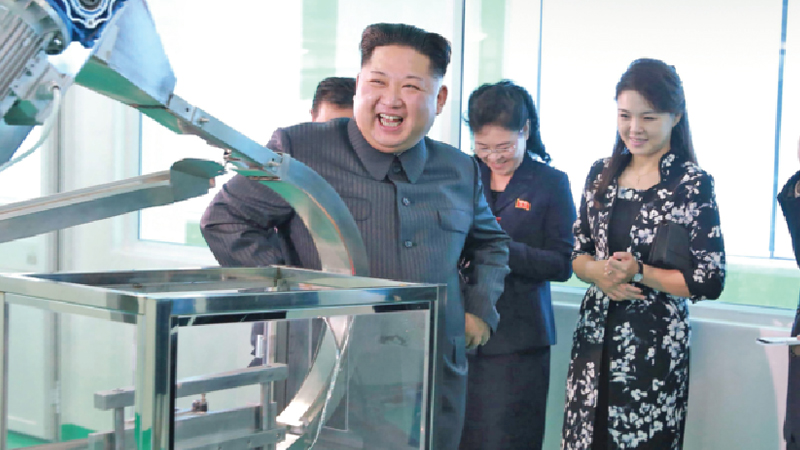 Kim tours cosmetics plant with wife, sister