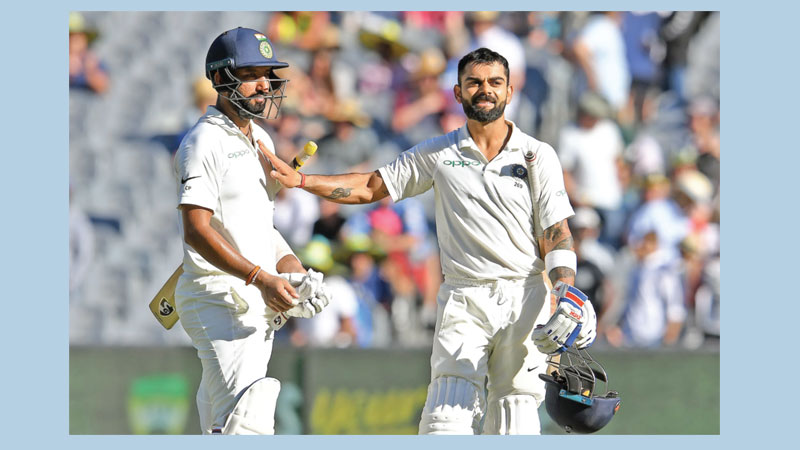Kohli, Pujara make Australia toil 