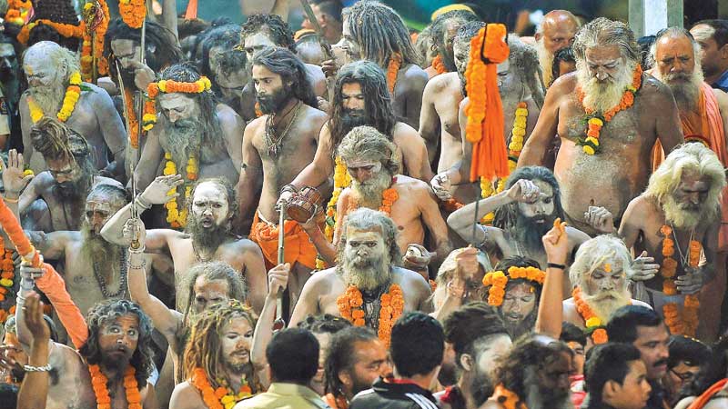 Tens of thousands take holy dip at Indias Kumbh Mela