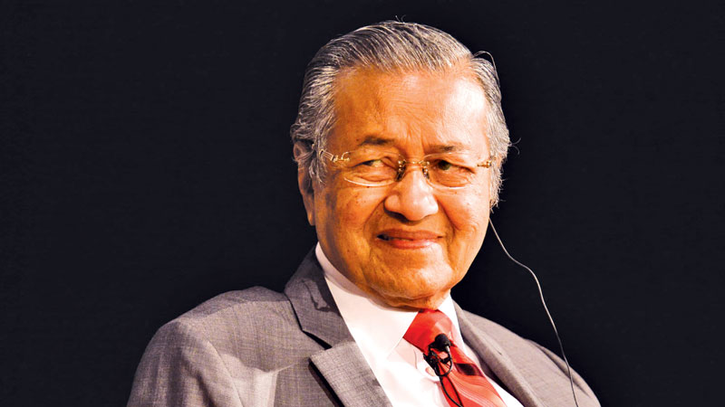 Malaysia PM denounces caning for 
lesbian sex