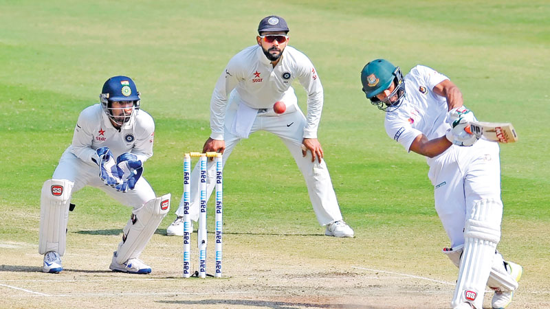 Indian spinners tame fighting Bangladesh