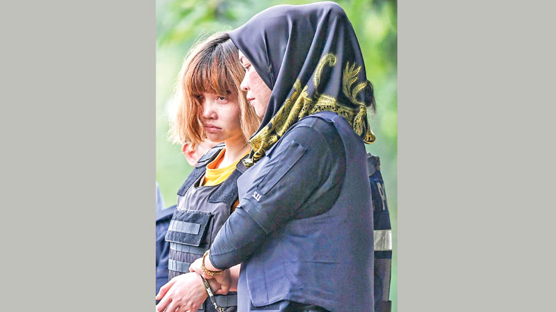 Malaysian court charges two women with Kim murder