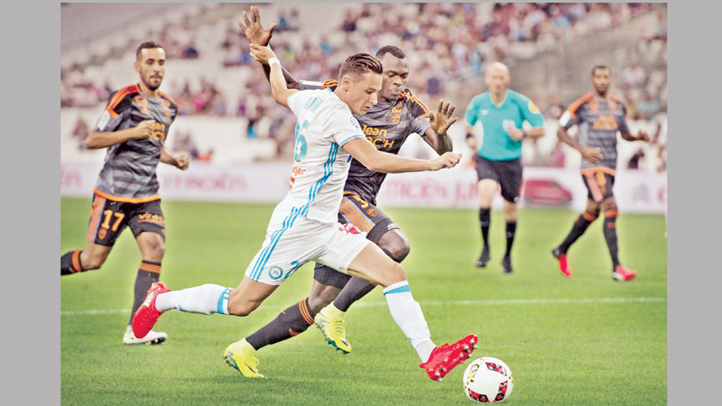 Marseille see off Lorient for first win 
