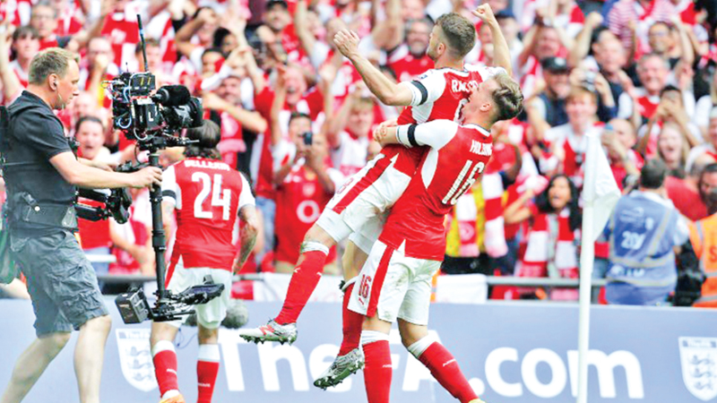 Mertesacker returns to inspire Arsenal’s cup glory