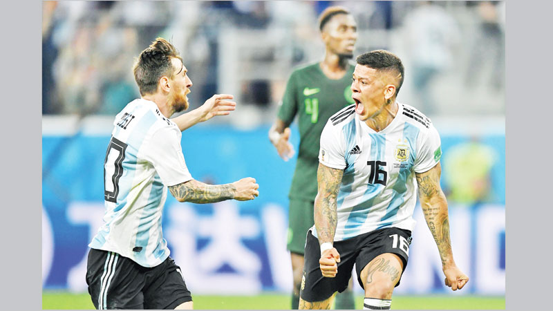 Messi, Rojo score to confirm Argentina berth in last 16