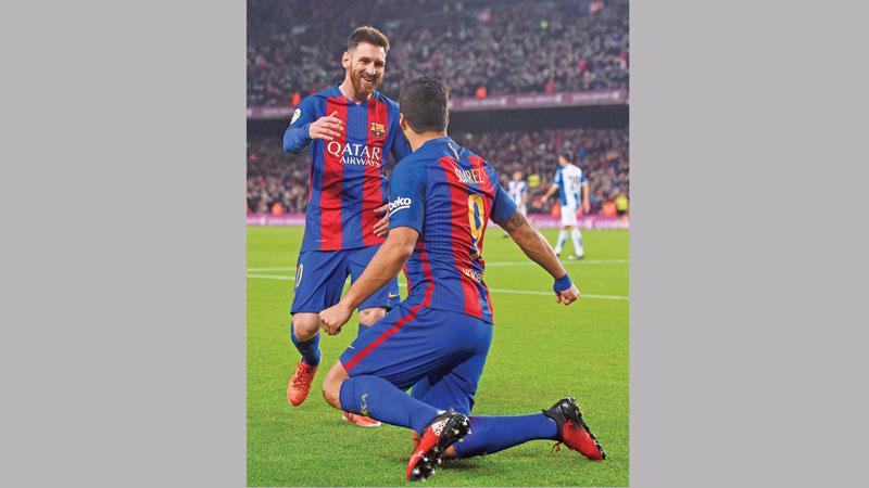 Suarez brace brings derby joy for Barca