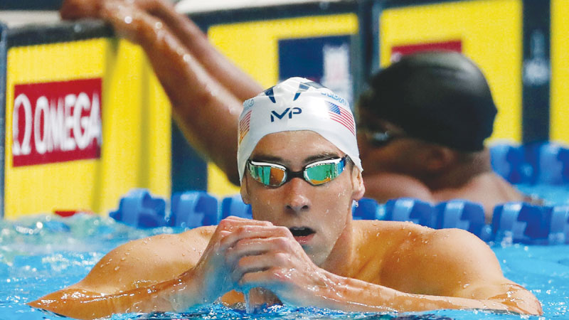 Phelps books 3rd Rio berth with 100m fly win