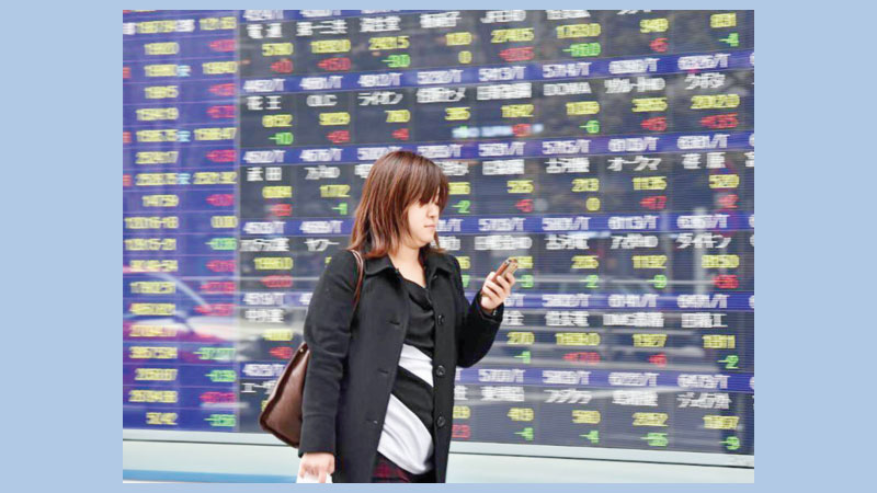Most Asian markets up but 
trade row rumbles on