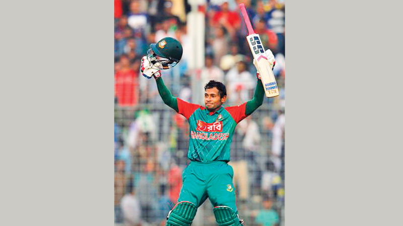 Mushfiq blasts ton in
rain marred match