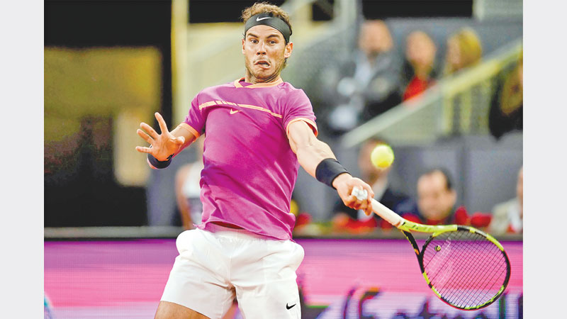 Nadal, Djokovic march on in Madrid